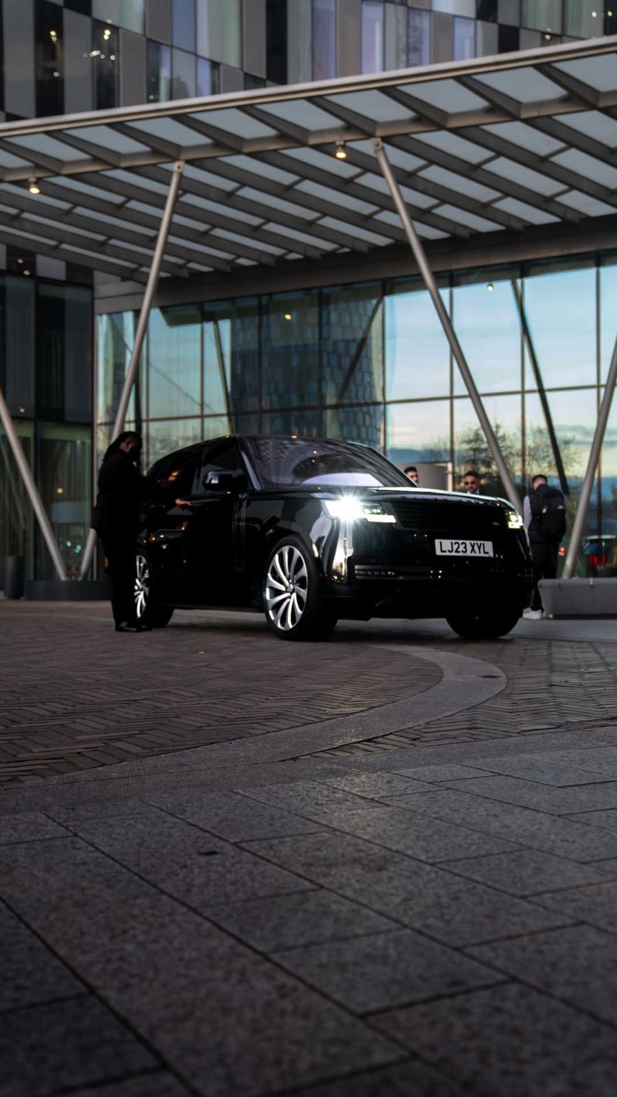 Chauffer with a Range Rover